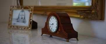 image of a clock on a mantelpiece